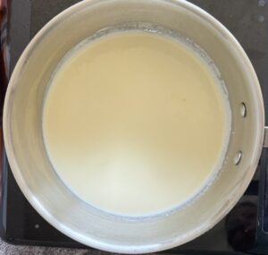 heavy cream in a large silver bowl.