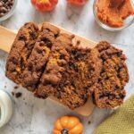 Pumpkin chocolate chip bread slices with a moist pumpkin crumb and melty chocolate chips.