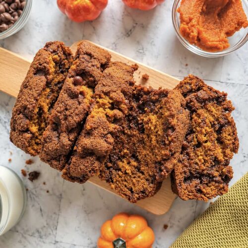 Pumpkin chocolate chip bread slices with a moist pumpkin crumb and melty chocolate chips.