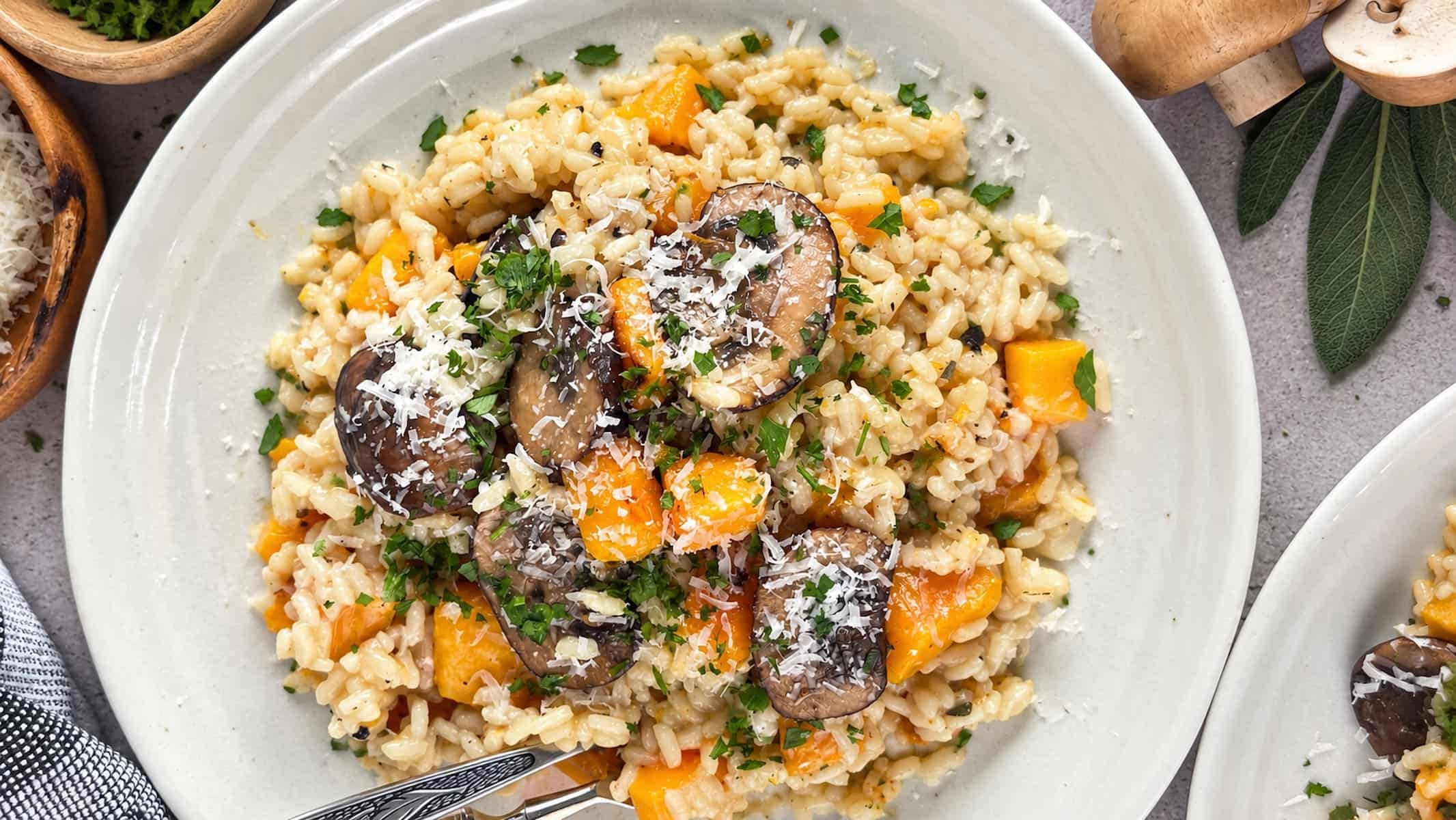 Butternut squash and mushroom risotto topped with Parmesan and fresh herbs.